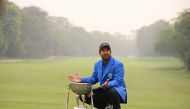 Indian golfer Shiv Kapur poses with the winning trophy after winning the Panasonic Open India golf tournament on the Asian Tour at the Delhi Golf Club in New Delhi on November 5, 2017. / AFP / SAJJAD HUSSAIN