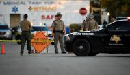 Law enforcement officials set up along a street near the First Baptist Church after a mass shooting in Sutherland Springs, Texas, US., November 5, 2017. REUTERS/Mohammad Khursheed