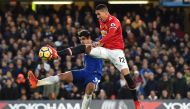 Chelsea's Spanish striker Alvaro Morata (L) vie with Manchester United's English defender Chris Smalling during the English Premier League football match between Chelsea and Manchester United at Stamford Bridge in London on November 5, 2017. AFP / Glyn KI