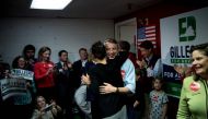 Virginia Republican gubernatorial hopeful Ed Gillespie hugs Jill Vogel, Republican nominee for lieutenant governor, during a rally on the eve of state elections, seen as a big test for US President Donald Trump, November 6, 2017 in Fairfax, Virginia. / AF