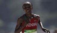 (FILES) This file photo taken on August 14, 2016 shows Kenya's Jemima Jelagat Sumgong running on her way to win the Women's Marathon during the athletics event at the Rio 2016 Olympic Games at Sambodromo in Rio de Janeiro. AFP / Adrian DENNIS
