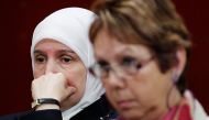 FILE PHOTO: Women look on during the National Assembly committee hearings on Bill 94 in Quebec City May 19, 2010. Bill 94 is a legislation which would predominantly affect women who wear the Islamic niqab or burka, and would require public employees, educ