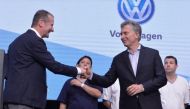 Argentina's President Mauricio Macri and Herbert Diess, chairman of the board of German carmaker Volkswagen, shake hands during a ceremony at Volkswagen's automotive terminal in General Pacheco, Argentina November 10, 2017. Argentine Presidency/Handout vi