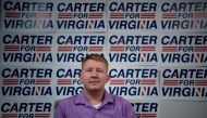 A file photo of Lee Carter, a socialist who won a seat during this year's elections in the Virginia House of Delegates for the 50th District, poses on November 9, 2017 in Manassas, Virginia. / AFP / Brendan Smialowski