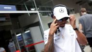 Mercedes' Lewis Hamilton of Britain walks after second practice. (REUTERS/Ueslei Marcelino)