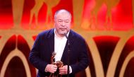Artist Ai Weiwei receives the Bambi trophy during the Bambi 2017 Awards ceremony in Berlin, Germany November 16, 2017. REUTERS/Axel Schmidt
