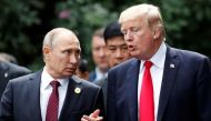 US President Donald Trump and Russia's President Vladimir Putin talk during the family photo session at the APEC Summit in Danang, Vietnam on Nov 11, 2017.PHOTO: REUTERS.