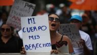 A file photo of women participating in a demonstration to ask for decriminalization of abortion in San Salvador, El Salvador, September 28, 2017. The writing on the placard reads, 