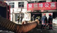Firefighters work at the site of a house fire, in Daxing district, Beijing, China early November 19, 2017. REUTERS/Stringer 