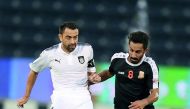 Al Sadd’s Xavi Hernandez (left) vies for ball possession with Umm Salal’s Adel Alawi Al Soleymani during their QNB Stars League match at Al Sadd Stadium yesterday. Al Sadd won 4-1.