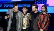 (L-R) Dan Reynolds, Ben McKee, Daniel Platzman, and Wayne Sermon of music group Imagine Dragons accept the Favorite Duo or Group - Pop/Rock award onstage during the 2017 American Music Awards at Microsoft Theater on November 19, 2017 in Los Angeles, Calif
