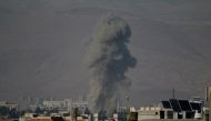 Smoke rises after Assad regime's war crafts carry out airstrikes over residential areas of Arbin town of the Eastern Ghouta region of Damascus in Syria on November 19, 2017. Samir Tatin - AA