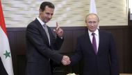 Russian President Vladimir Putin (R) meets with Syrian President Bashar al-Assad in the Black Sea resort of Sochi, Russia November 20, 2017. Sputnik/Mikhail Klimentyev/Kremlin via REUTERS
