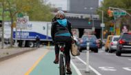 File photo of a woman riding a bicycle along a designated bike lane in New York. REUTERS/Shannon Stapleton
