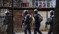 Georgian armed counter-terrorist units move around an apartment block in Tbilisi on November 22, 2017, as part of a special operation. AFP / Vano Shlamov
