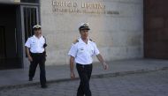 A photo of Argentine Navy spokesman, Captain Enrique Balbi (R) heads for a press conference to announce last news on the missing ARA San Juan submarine, outside the Navy headquarters in Buenos Aires, on November 22, 2017. / AFP / TELAM / VICTOR CARREIRA