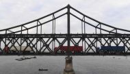 A file photo of the trucks returning over the Friendship Bridge from the North Korean town of Sinuiju to the Chinese border city of Dandong in Liaoning province. AFP.