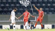 Al Duhail players celebrate after scoring a goal against Al Sadd during their QNB Stars League match played at Al Sadd Stadium yesterday.  