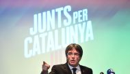 Deposed Catalan leader Carles Puigdemont gives a press conference in Oostkamp, near Brugge, on November 25, 2017, to announce his candidacy for Catalan regional elections and unveil his electoral list for the December 21 election. The slogan reads 