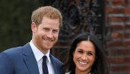 Britain's Prince Harry poses with Meghan Markle in the Sunken Garden of Kensington Palace, London, Britain, November 27, 2017. REUTERS/Toby Melville
