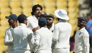 Indian cricketer Ishant Sharma (C) celebrates with teammates after taking the wicket of Sri Lanka batsman Niroshan Dickwella during the fourth day of the second Test cricket match between India and Sri Lanka at the Vidarbha Cricket Association Stadium in 