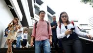 Civil rights activist Jolovan Wham (C) leaves the State Court after a hearing in Singapore November 29, 2017. REUTERS/Edgar Su.
