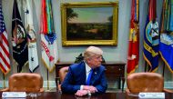 US President Donald Trump (C) makes a statement from the Roosevelt Room next to the empty chairs of Senate Minority Leader Chuck Schumer (L), D-New York, and House Minority Leader Nancy Pelosi (R), D-California, after they cancelled their meeting at the W
