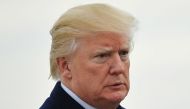 US President Donald Trump makes his way to board Air Force One before departing from John F. Kennedy International Airport in New York, New York on December 2, 2017. AFP / MANDEL NGAN