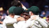 Australia's players react after they defeated England on the final day of the second Ashes cricket Test match in Adelaide in December 6, 2017. / AFP / William WEST