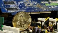 A copy of bitcoin standing on PC motherboard is seen in this illustration picture, October 26, 2017. REUTERS/Dado Ruvic/File Photo