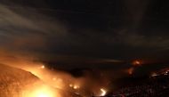 The Thomas fire burns in the Los Padres National Forest on December 8, 2017 near Ojai, California. The Thomas fire has burned over 132,000 acres and has destroyed 439 structures. Justin Sullivan/AFP
