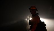 A firefighter monitors hot spots as the Thomas fire burns in the Los Padres National Forest on December 8, 2017 near Ojai, California. Justin Sullivan/AFP
