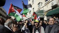 Palestinian demonstrators shout slogans during a protest against U.S. President Donald Trump’s announcement to recognize Jerusalem as the capital of Israel and plans to relocate the U.S. Embassy from Tel Aviv to Jerusalem, on December 9, 2017 in East Jeru