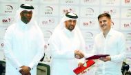 Camilo Soto of Argentina, the new Qatar volleyball coach, shakes hands with President of Qatar Volleyball Association (QVA) Ali bin Ghanim Al Kuwari during a press conference in Doha yesterday. QVA Board Member Mubarak Eid Al Abdullah was also present. 