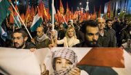 Members of the Greek communist party KKE take part in a demonstration in Athens on December 8, 2017, after US President Donald Trump's controversial order recognising 
Jerusalem as Israel's capital. / AFP.