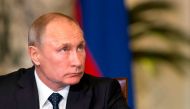 Russian President Vladimir Putin looks on during a press conference with his Egyptian counterpart (unseen) following their talks at the presidential palace in the capital Cairo on December 11, 2017.   AFP / POOL / Alexander Zemlianichenko

