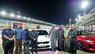Abdulaziz Al Attiyah (centre), Chairman of Al Attiyah Motors and Trading and Nasser Salih Nasser Abdullah Al Attiyah, World Rally Champion, with other officials during KIA Stinger exclusive premiere at Lusail International Ciruit, yesterday. Pics: Baher A