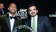 Qatar Olympic Committee President H E Sheikh Joaan bin Hamad Al Thani poses for a photograph with champion high jumper Mutaz Essa Barshim after the latter won the ‘World Athlete of the Year 2017’ trophy at the IAAF Awards in Monaco in this November 24 fil