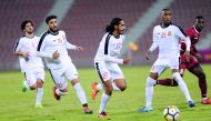 Umm Salal players in action during their QSL Cup match against Al Markhiya  at Al Arabi Stadium.