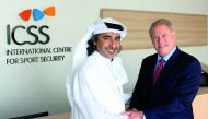 This file photo shows ICSS President Mohammed Hanzab of Qatar and Michael Hershman, ICSS Group CEO.