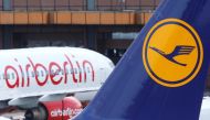 FILE: A Lufthansa airliner parks next to the Air Berlin aircraft at Tegel airport in Berlin, Germany, October 12, 2017. REUTERS/Hannibal Hanschke
