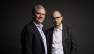 The incoming publisher of the New York Times Arthur Gregg (A.G.) Sulzberger and his father Arthur Ochs Sulzberger Jr. (L) pose for pictures on the 16th floor of the New York Times building in New York, U.S. on December 12, 2017. (Damon Winter/The New York