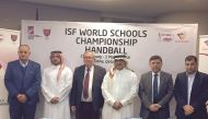 Qatar School Sports Association Secretary General Ali Ahmed Al Hitmi and International School Sports Federation Deputy President Stelios Daskalakis along with other officials pose for a group photo following a draw ceremony for the 24th ISF World Schools 