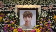 The portrait of Kim Jong-Hyun, a 27-year-old lead singer of the massively popular K-pop boyband SHINee, is seen on a mourning altar at a hospital in Seoul on December 19, 2017.  / AFP / pool / CHOI Hyuk