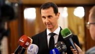 Syrian President Bashar al-Assad speaking to the press after receiving a Russian delegation in Damascus. / AFP / SANA 
