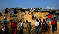 Rohingya refugees make their way at the Kutupalong refugee camp near Cox's Bazar, Bangladesh December 19, 2017. REUTERS/Alkis Konstantinidis