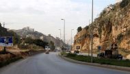 Cars pass near the area where British embassy worker Rebecca Dykes' body is believed to have been found by a main road outside Beirut, Lebanon December 18, 2017. REUTERS/Mohamed Azakir