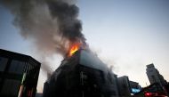 Smoke rises from a burning building in Jecheon, South Korea, December 21, 2017. Yonhap via REUTERS.