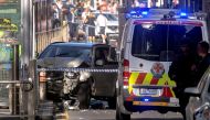 Australian police stand near a crashed vehicle after they arrested the driver of a vehicle that had ploughed into pedestrians at a crowded intersection near the Flinders Street train station in central Melbourne, Australia December 21, 2017. REUTERS/Luis 