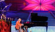 The popular pianist on a stage in Germany; picture from the image gallery on his website. 